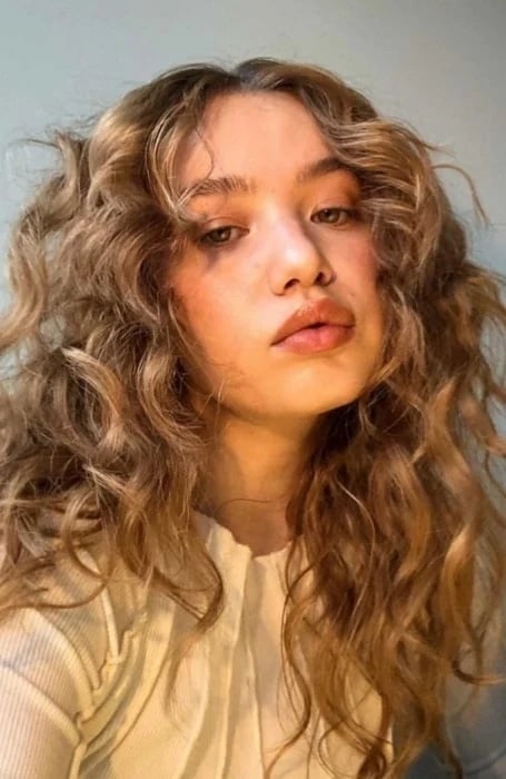 Long Curly Hair With Curtain Bangs