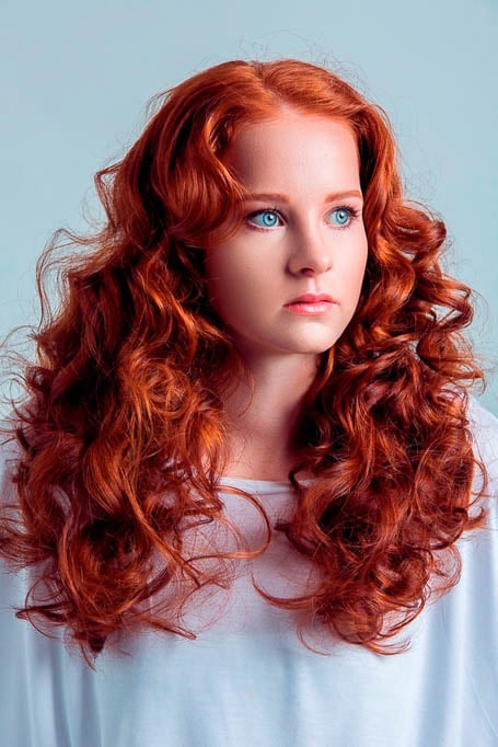 Red Orange Curls With Curtain Bangs