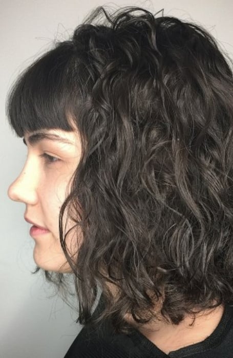 Subtle Perm With Straight, Blunt Bangs