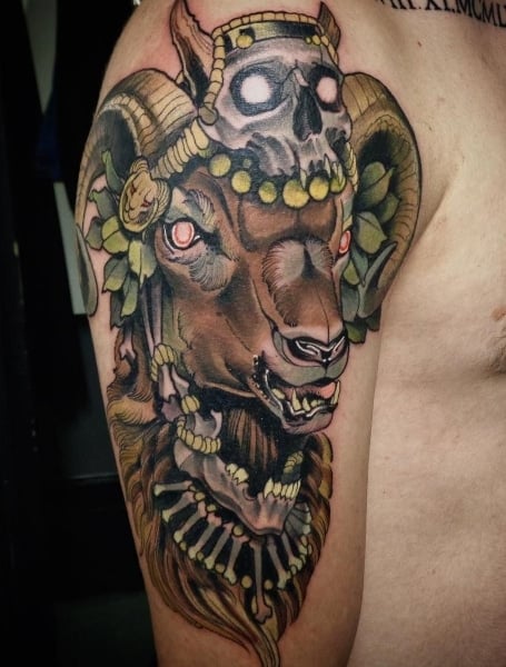 Neotraditional style posh ram tattoo on the right