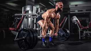 Muscular Man Doing Heavy Deadlift Exercise