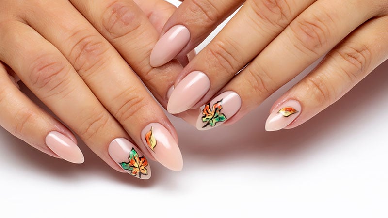 Autumn Gel Nail Design. Nude Manicure With Painted Maple Leaves