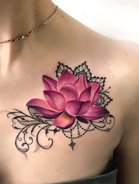 Realistic lotus flower tattoo on the left shoulder