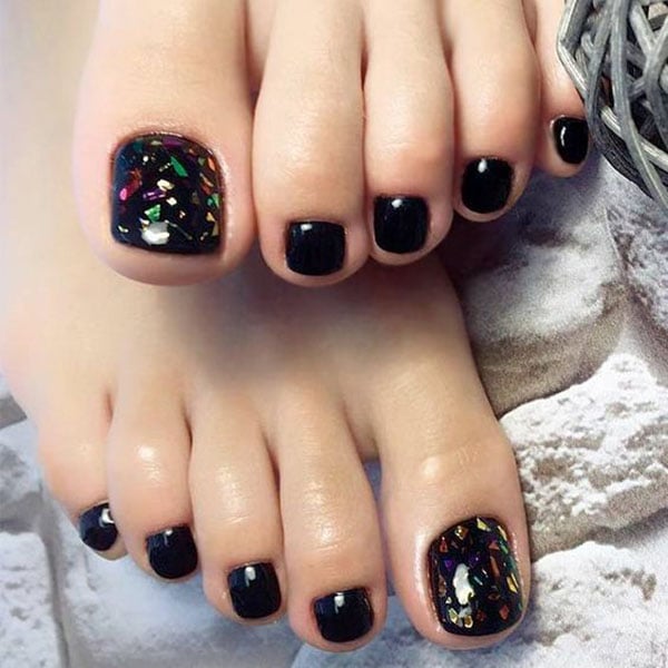 Beautiful female feet with fashion manicure nails, white an silver gel  polish Stock Photo | Adobe Stock