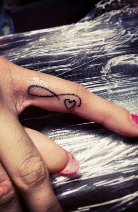 Infinity ring finger best sale tattoo