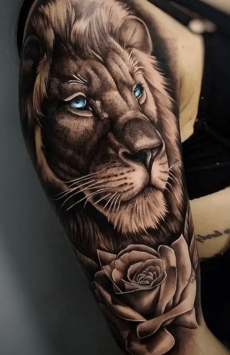 Single needle lion tattoo on the right ribcage