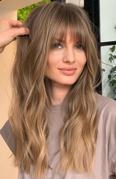 Image of Shaggy wispy bangs with medium-length beach waves