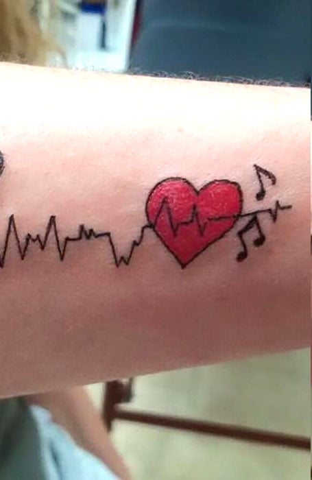 OM WITH HEARTBEAT TATTOO CRAZY INK TATTOO BODY PIERCING SURAT in Surat India