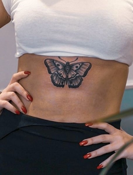 Butterfly tattoo on the stomach