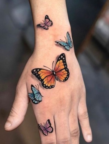 cross with butterfly tattoo