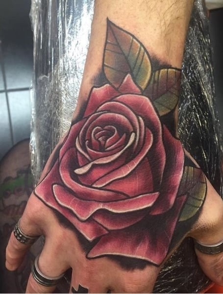 Tattoo uploaded by Rebecca  Red hand rose tattoo by Matt Webb MattWebb  rose neotraditional roses hand  Tattoodo