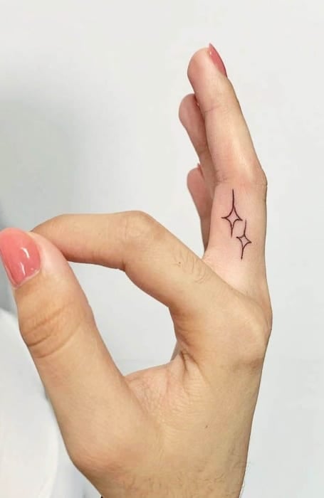 Small Simple Anchor Tattoo On Ring Finger For Girl