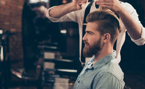 Profile View Of A Red Bearded Stylish Barber Shop Client. He Is