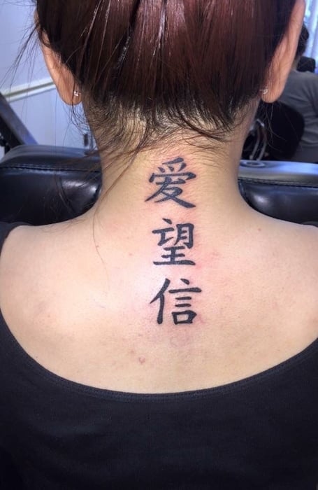 Minimalist chinese character tattoo behind the ear