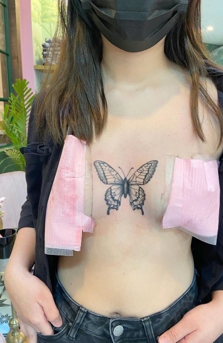 Butterfly Sternum Tattoo