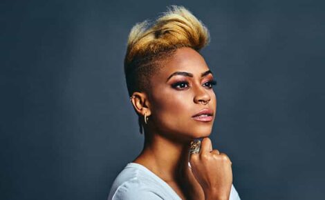 Portrait Of A Very Confident Young Woman With Cool Short Voluminous Hair And Trendy Nose Ring Thinking And Looking To Side
