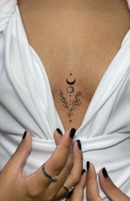Feminine meaningful small sternum tattoo