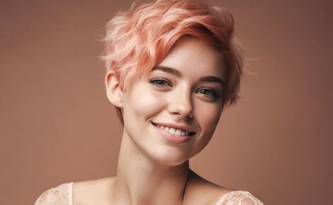 Beauty Portrait Of A Young Smiling Woman With Short Pink Hair On